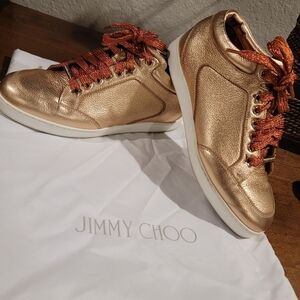 Jimmy Choo Gold Sneakers with Red Laces